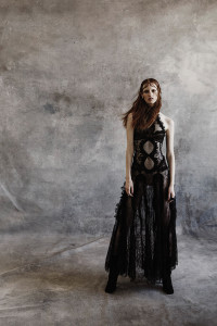 Alexander McQueen’s metallic lace gown and shoes. Ring by Flow